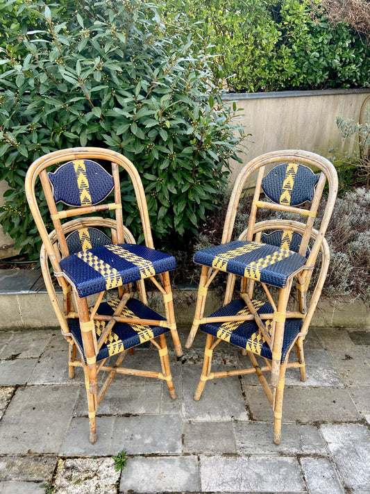 Six chaises "Maison Drucker" en rotin et fibres satinées.