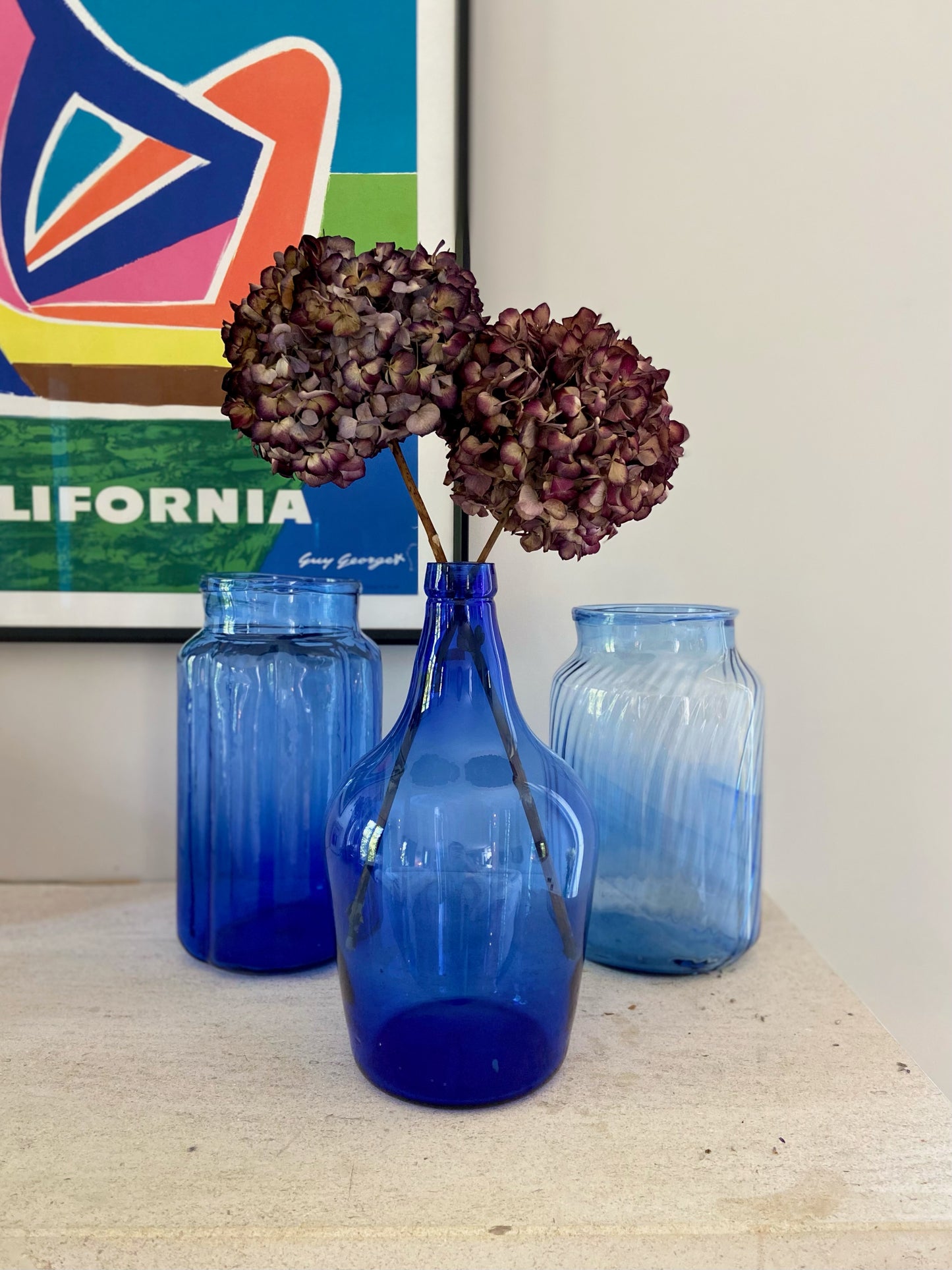 Assortment of 3 bluish glass jars